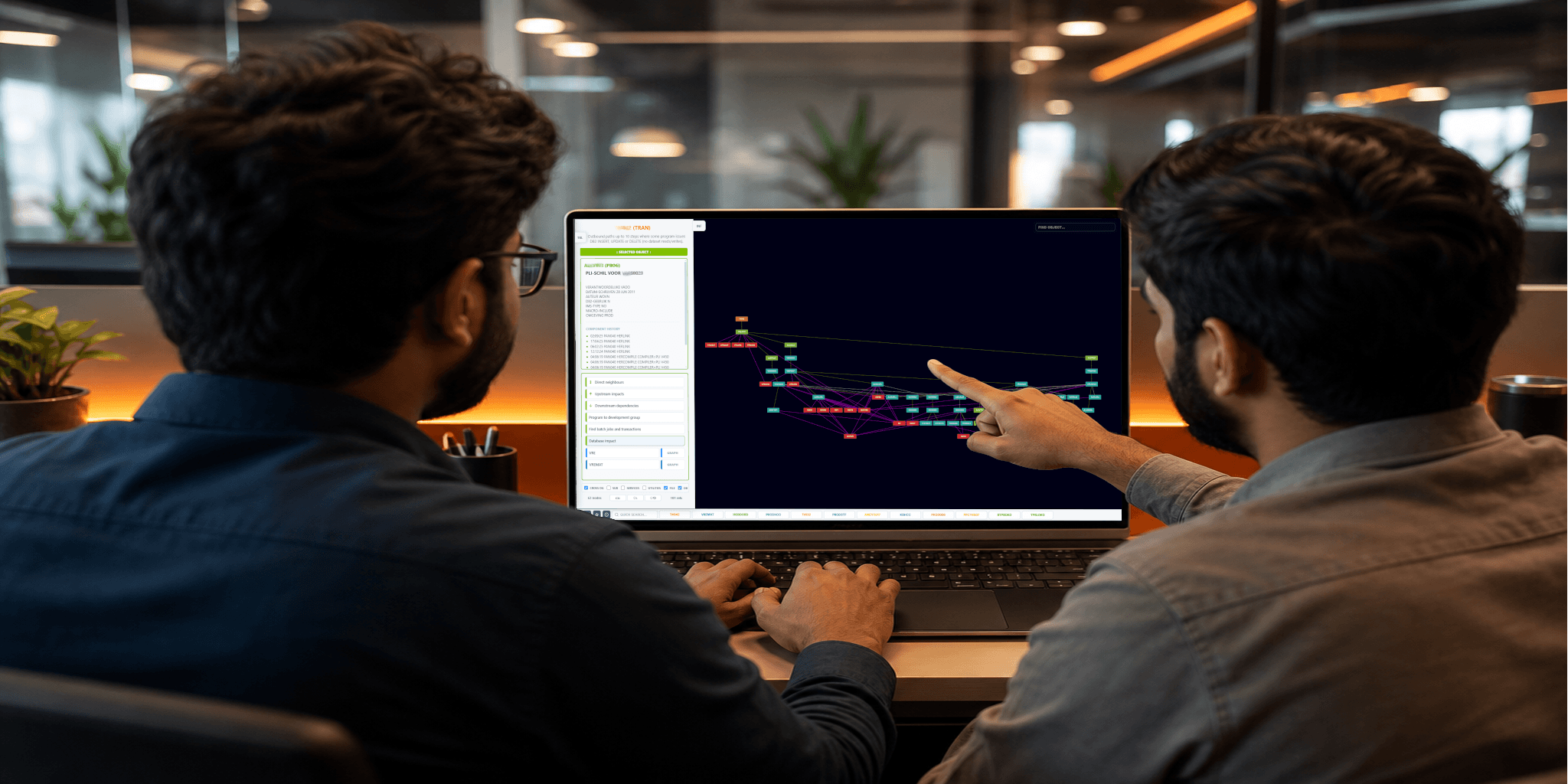 Two developers collaborating at a workstation